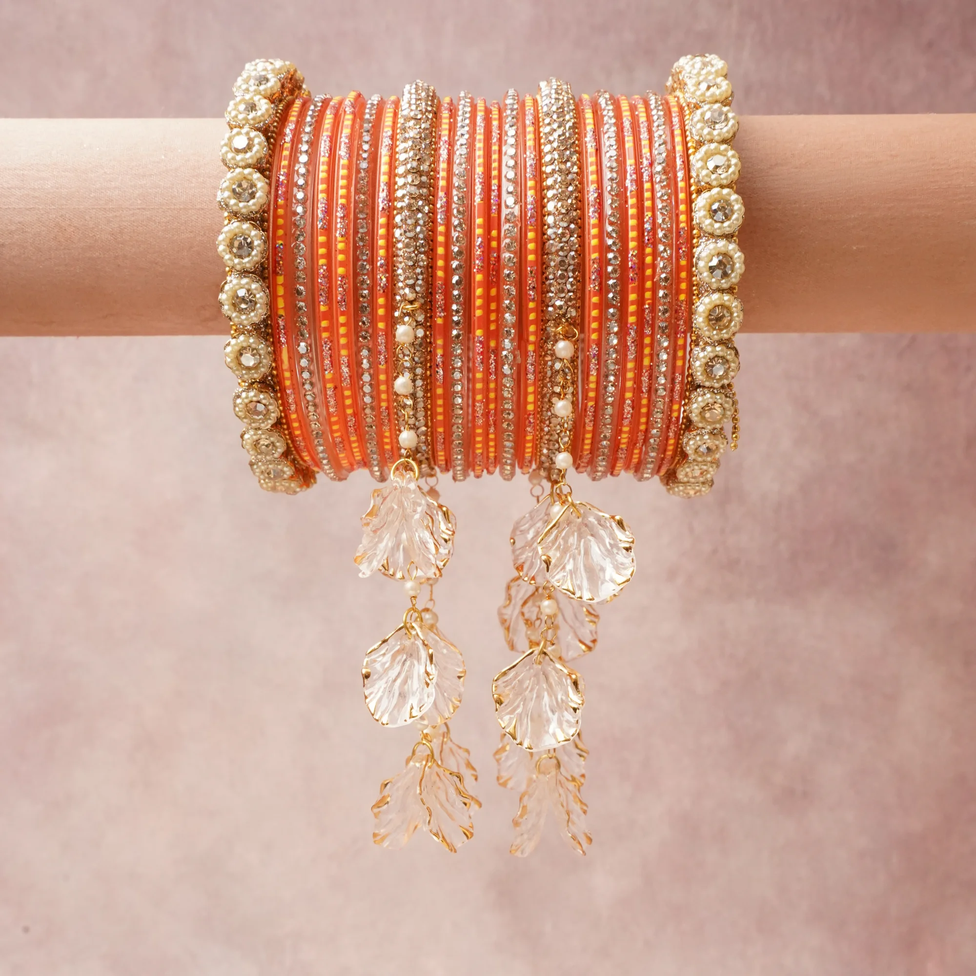 A commanding Terracotta Orange anchors this beautiful set, enriched with accents of Clear Crystal, Metallic Gold, Cream Pearl, Marigold Yellow that add depth and dimension.

Featuring a striking composition of Lacquered Resin, Rhinestone, Faux Pearl, Gold-toned Metal, Acrylic, this set carries intricate craftsmanship and strong presence. Grand in form, it is created for moments that deserve to be marked.
